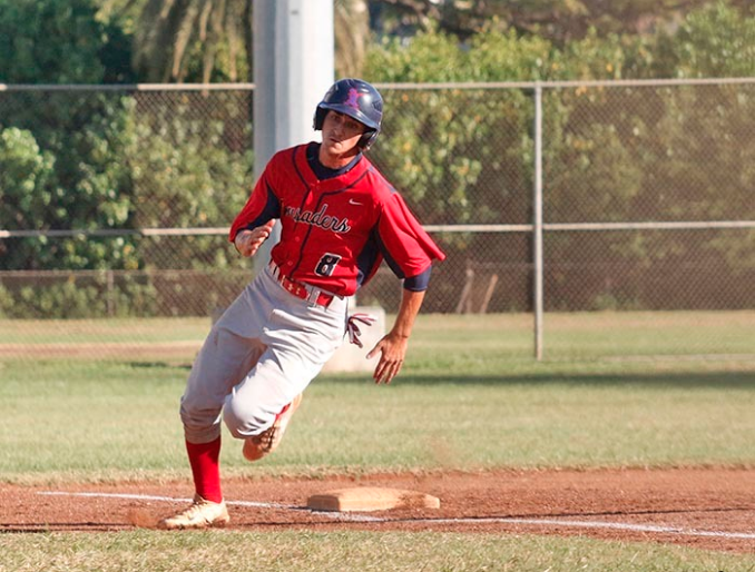 Senior Charles Lopez rounds third base. Lopez is one of many promising returnees for the Crusaders. Picture by Kainalu Reyes-Hackney