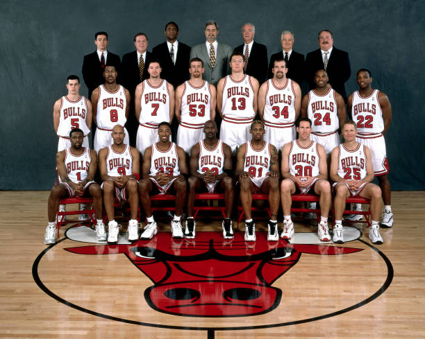 CHICAGO - 1998: The 1997-98 NBA Chicago Bulls pose for a team portrait in Chicago, IL. Front row (left to right): Randy Brown, Ron Harper, Scottie Pippen, Michael Jordan, Dennis Rodman, Jud Buechler, Steve Kerr. Second row: , Rusty LaRue, Dickey Simpkins, Toni Kukoc, Joe Klein, Luc Longley, Bill Wennington,  Scott Burrell, Keith Booth. Back Row: Chip Schaefer (Trainer), Frank Hamblen  (Asst Coach), Bill Cartwright (Asst. Coach), Head coach Phil Jackson, Jimmy Rodgers (Asst. Coach) , and Tex Winter (Asst. Coach), John Ligmanowski (Equip Manager). NOTE TO USER: User expressly acknowledges  and agrees that, by downloading and or using this  photograph, User is consenting to the terms and conditions of the Getty Images License Agreement. Mandatory copyright notice: Copyright NBAE 1998 (Photo by Bill Smith/ NBAE/ Getty Images)