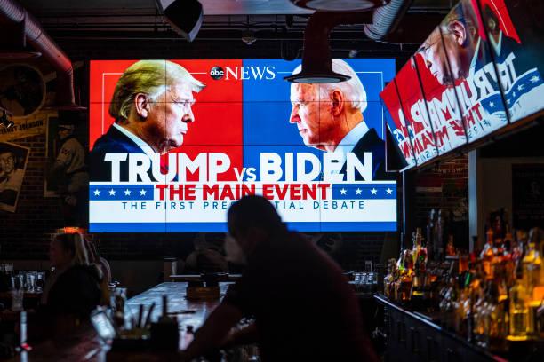 WASHINGTON, DC - SEPTEMBER 29: Television screens airing the first presidential debate are seen at Walters Sports Bar on September 29, 2020 in Washington, United States. Americans across the country tuned in to the first presidential debate between Donald Trump and Joe Biden held in Cleveland. (Photo by Sarah Silbiger/Getty Images)