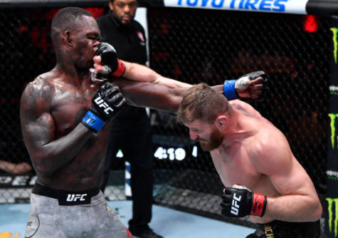 LAS VEGAS, NEVADA - MARCH 06: (R-L) Jan Blachowicz of Poland punches Israel Adesanya of Nigeria in their UFC light heavyweight championship fight during the UFC 259 event at UFC APEX on March 06, 2021 in Las Vegas, Nevada. (Photo by Jeff Bottari/Zuffa LLC)